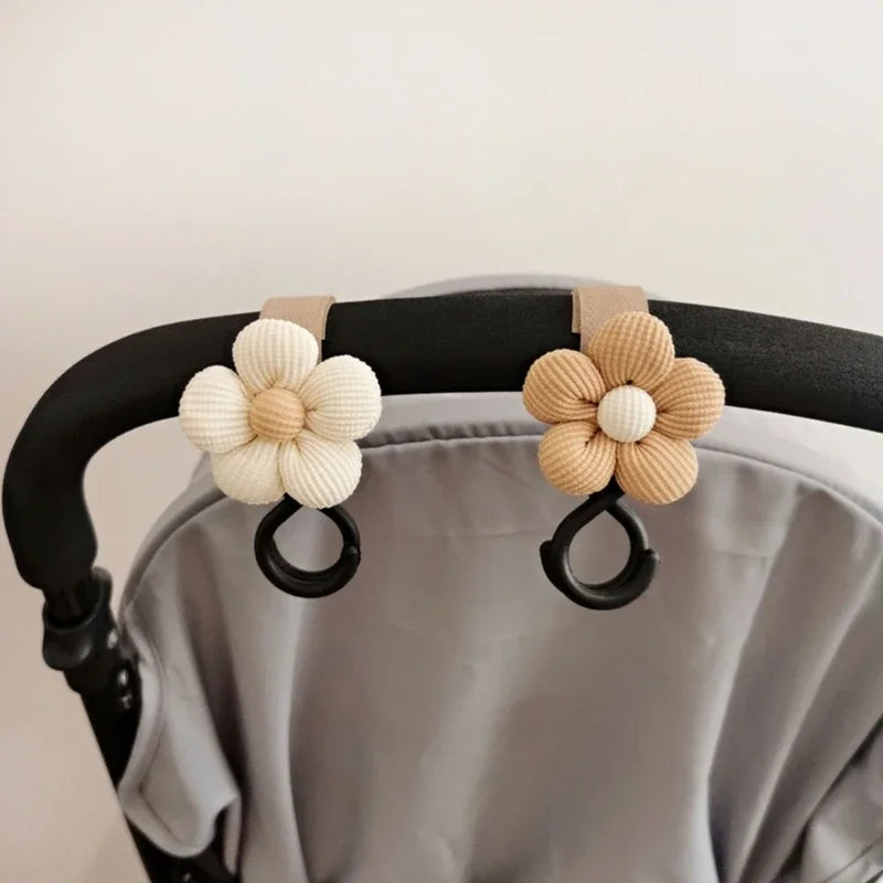 "Sweet Flower Baby Stroller Hook - Convenient Storage Solution for Infant Supplies"